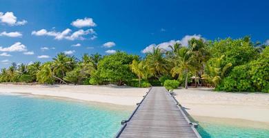 Amazing panorama landscape of Maldives beach. Tropical beach landscape seascape, luxury water villa resort wooden jetty. Luxurious travel destination background for summer holiday and vacation concept photo