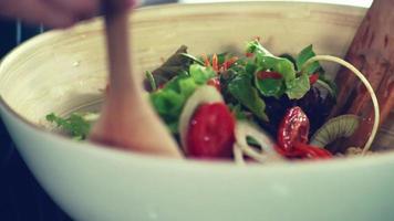 make healthy food salads in the home kitchen with vegetables and organic ingredients close-up background
