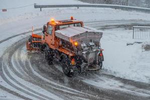 Bergamo Italy 2021 Mechanical vehicle in action to clear the road from snow photo