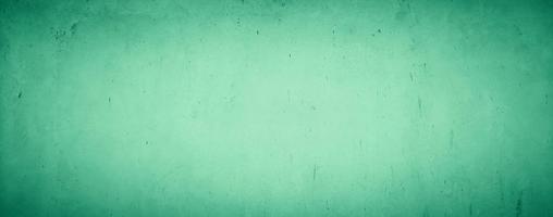 abstract grungy concrete wall texture background with green pastel color photo