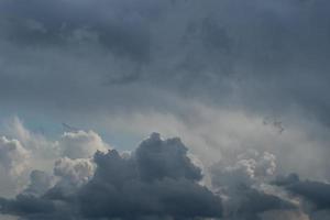 Rain clouds illuminated by sun background. photo