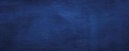 dark blue abstract texture background of wall cement concrete photo