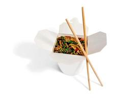 Wok noodles in the white box isolated on white background photo