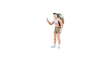 Close up of Miniature backpacker and tourist people isolated with clipping path on white background.Elegant Design with copy space for placement your text, mock up for business and travel concept photo