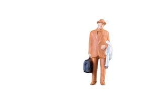 Close up of Miniature businessman and tourist people isolated with clipping path on white background.Elegant Design with copy space for placement your text, mock up for business and travel concept photo