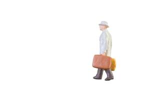 Close up of Miniature businessman and tourist people isolated with clipping paht on white background.Elegant Design with copy space for placement your text, mock up for business and travel concept photo