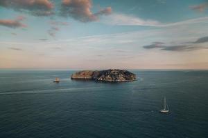 view of an island of the coast of the sea photo