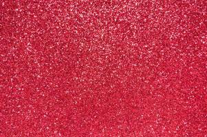 Abstract red festive sparkle glitter background. photo