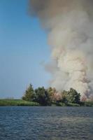 Large clouds of smoke, fire in nature. photo