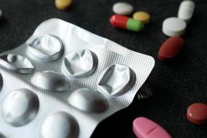 Close up of empty pills of blister pack on table photo