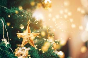 New Year concept,Close up of balls on christmas tree. Bokeh garlands in the background. photo