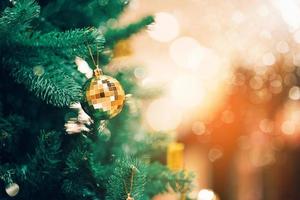 New Year concept,Close up of balls on christmas tree. Bokeh garlands in the background. photo