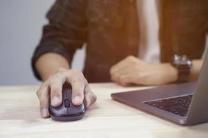 Man typing on laptop or computer photo