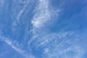 Clear blue sky with plain white cloud photo