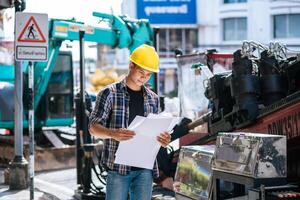 Civil engineers work on large road and machinery conditions. photo