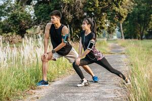 Men and women warm up before and after exercising. photo