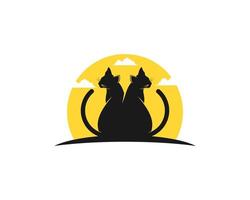 Twin black cat with yellow sunset behind vector