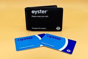 London, England, United Kingdom,  2014 - London Oyster card isolated over orange background. Transport for London photo