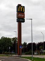 Bologna, Italy, 2021 - McCafe, and McDrive signs on a pole. Bologna, Italy photo