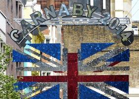 London, United Kingdom, 2014 -  street sign arch. Carnaby street is a famous fashion shopping areas of Soho, London. photo