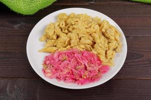 Whole-grain pasta with tofu on a table photo