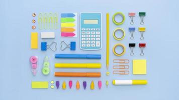 top view colorful office stationery with calculator paper clips