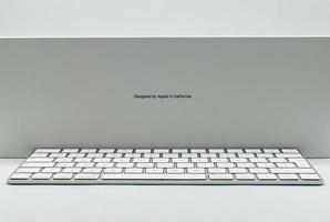 Bologna, Italy, 2021 - New iMac 21,5 inch keyboard personal computer made by Apple Computers, isolated on white background. Side view