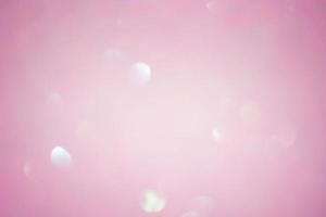Abstract background blurred focus pink glitter. Pink sparkles defocus light. photo
