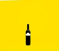 wine bottle in yellow background photo
