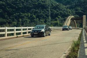 Bento Goncalves, Brazil - July 10, 2019. Cars passing by the Ernesto Dornelles concrete bridge near Bento Goncalves. A friendly country town in southern Brazil famous for its wine production. photo