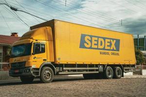 Cambara do Sul, Brazil, July 19, 2019. Sedex truck, an express delivery service from the Brazilian Post Service, in a street of Cambara do Sul. A town with amazing natural tourist attractions. photo