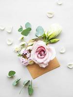 Envelope full of various flowers photo