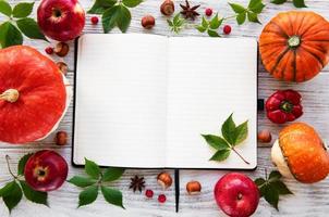 Empty notebook with pumpkins photo