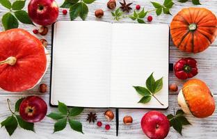 Empty notebook with pumpkins photo