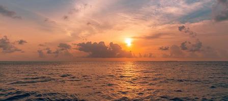 Ocean and clouds it is low over water in the afternoon. Beautiful seascape. Sea waves beach. shore, coast photo