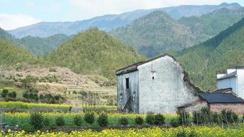 The  beautiful and old traditional Chinese village view with the mountains around it located in the countryside of the southern China photo