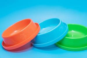 Plastic bowl for animal on color background photo