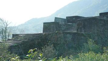 One old stone arched bridge located in the countryside of the southern China photo