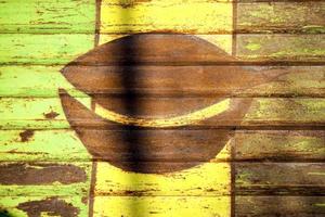 Rusty striped metal background with green and yellow paint. photo