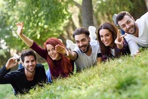 Group of young people together outdoors in urban background photo