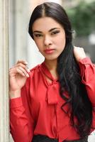 Hispanic stewardess in urban background photo