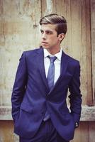 Attractive young businessman in urban background photo
