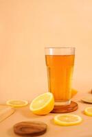 A glass of tea decorated with sliced oranges around photo