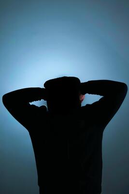 Indonesia, 21122021 - a silhouette of a man in a black hoodie 4909878 Stock  Photo at Vecteezy