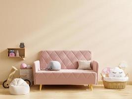 Sofa in child room interior with copy space on wall cream color background. photo