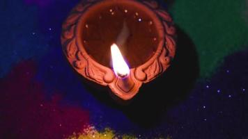 indian festival of lights Loop 4K background Diya lamp with fire lighting for Diwali, Deepavali or Dipavali, video
