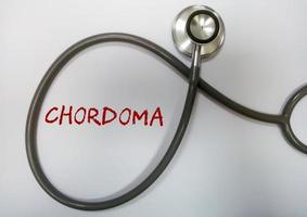 Chordoma word, medical term word with medical concepts in blackboard and medical equipment. photo