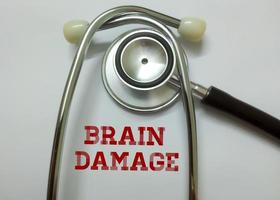Brain damage word, medical term word with medical concepts in whiteboard and stethoscope.