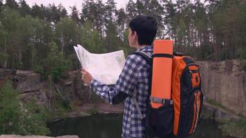 Climber in canyon with backpack. video