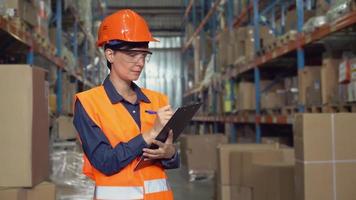 Portrait employee at work in storehouse. video